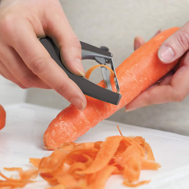Peeling carrots with a Zeal Palm Fit Peeler