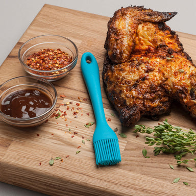 Using a Zeal Silicone Pastry Brush to baste chicken