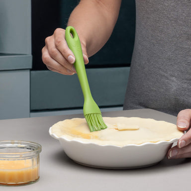 Using a Zeal Silicone Pastry Brush to egg wash a pie lid