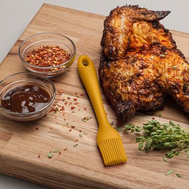 Using a Zeal Silicone Pastry Brush to baste chicken