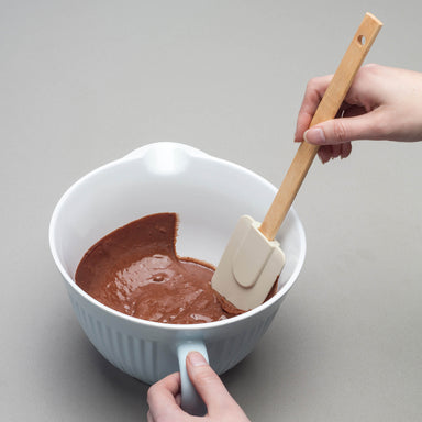Using a Zeal Silicone Spatula to scrape a bowl
