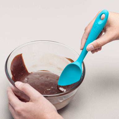 Using a Zeal Silicone Spatula Spoon to scrape a bowl
