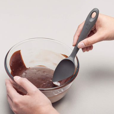 Using a Zeal Silicone Spatula Spoon to scrape a bowl