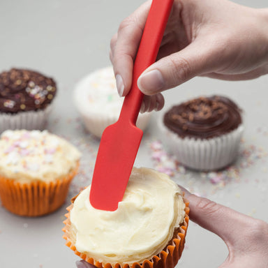Using a Zeal Silicone Mini Baking Spatula to ice fairy cakes