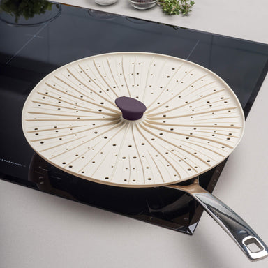 Zeal Mushroom Silicone Splatter Guard in use on a frying pan