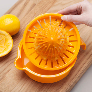 Zeal Easy Squeeze Juice Extractor catching juice
